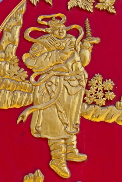 Chinesische goldene Wandmalerei auf rotem Holz — Stockfoto