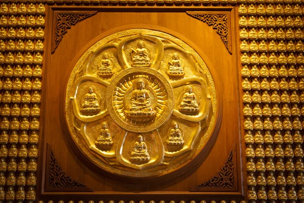 Golden chinese buddha statue on wood — Stock Photo, Image
