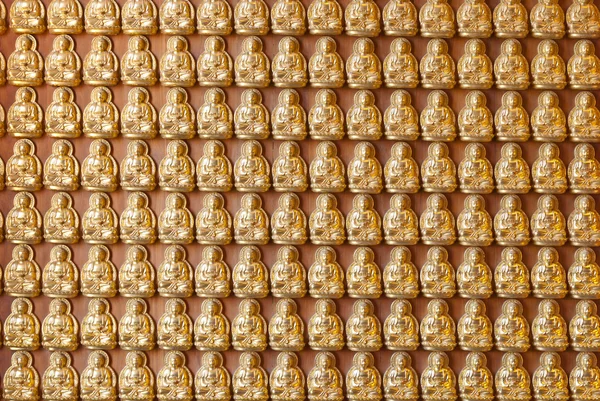 stock image Hundreds of golden Budhha statues background