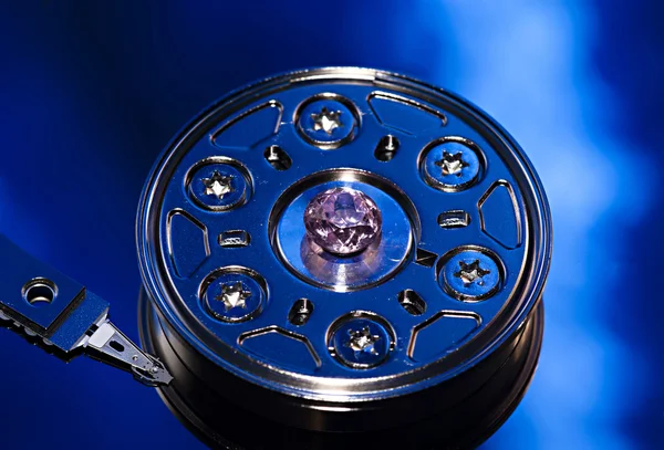 The disassembled hard disk of the computer on a dark blue backgr — Stock Photo, Image