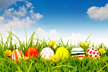 Easter Eggs with flower on Fresh Green Grass clipart