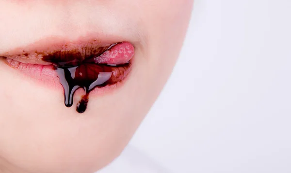 Woman lips with chocolate — Stock Photo, Image