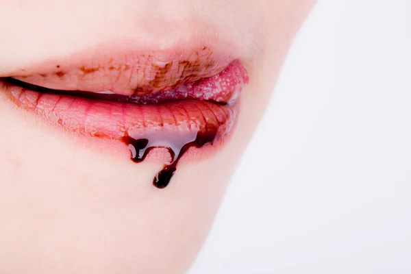 Woman lips with chocolate — Stock Photo, Image