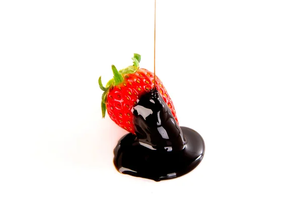 Fresh strawberry covered in dark chocolate — Stock Photo, Image
