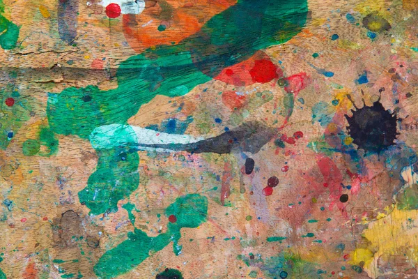 Pintura Grunge sobre fundo de madeira — Fotografia de Stock