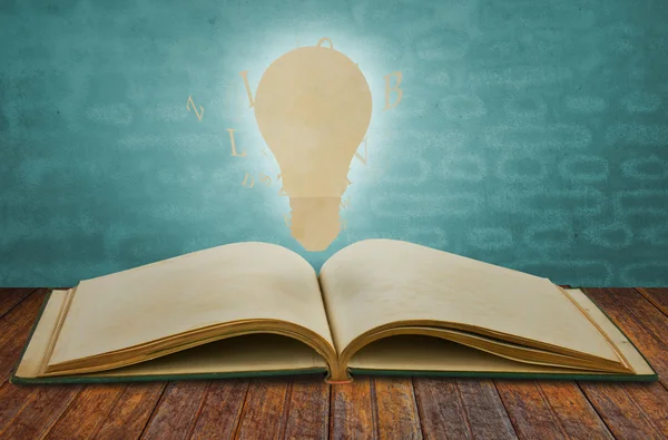 Paper cut of book of light bulb — Stock Photo, Image
