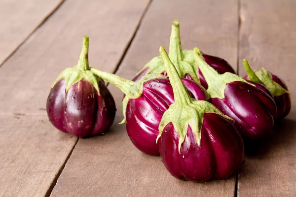 stock image Eggplant on wood