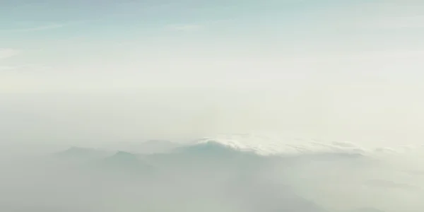 stock image Mountain between clouds