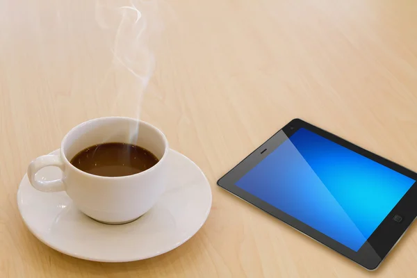 Touch screen device and cup of coffee — Stock Photo, Image
