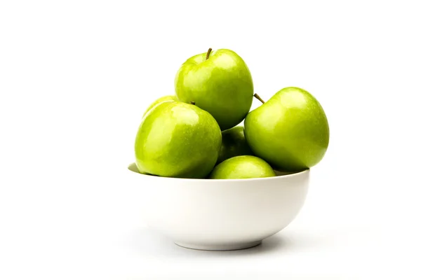 Green apple on plate isolated on white background Stock Photo