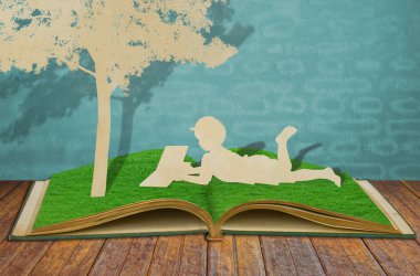 Paper cut of children read a book under tree on old book clipart