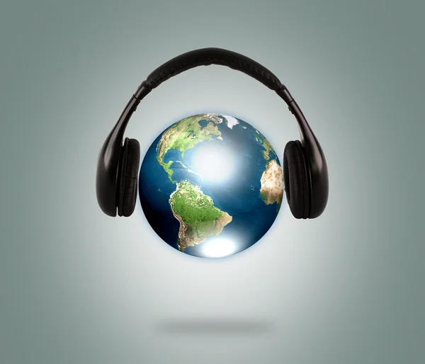 stock image Earth with headphone (Elements of this image furnished by NASA)