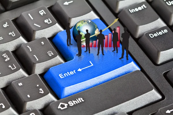 Silhouettes of busineswith red graph and earth on enter keyboard — Stock Photo, Image