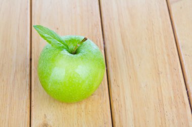 Fresh green apple on table clipart