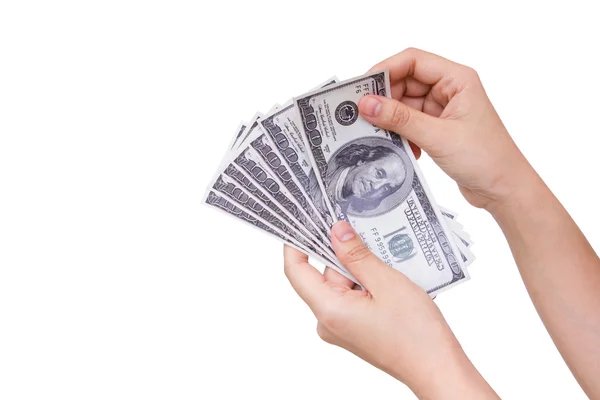 Mãos segurando dólares isolados no fundo branco — Fotografia de Stock