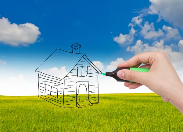Business handen med pennan ritar ett hus — Stockfoto