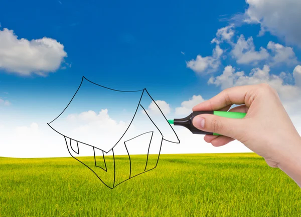 Business hand with pen drawing a house — Stock Photo, Image