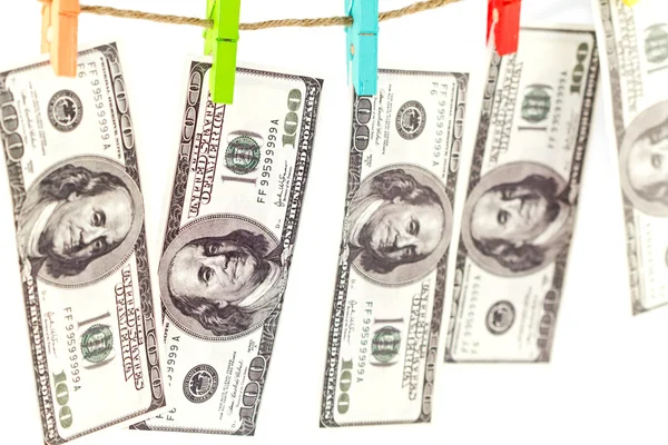 Dollari su una corda isolata su bianco — Foto Stock