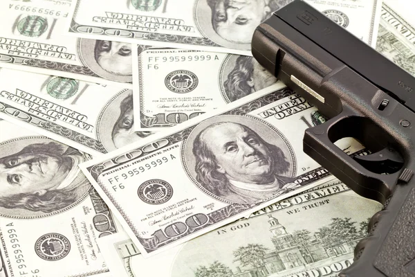 Stock image Close up image of pistol and dollar