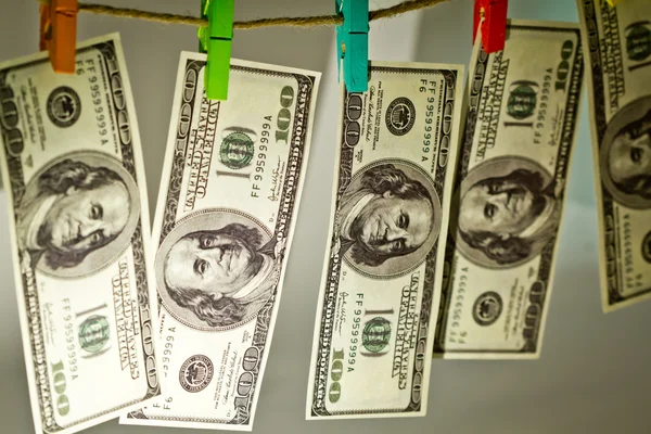 Dólares em uma corda isolada em branco — Fotografia de Stock