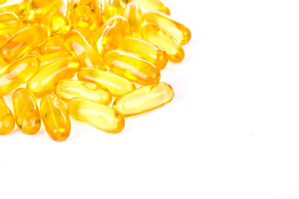 Capsules of fish oil and vitamins on white background. — Stock Photo, Image
