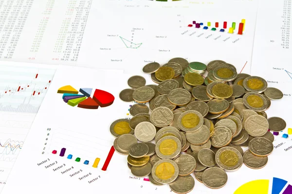 Tree growing from coins on financial Graphs — Stock Photo, Image