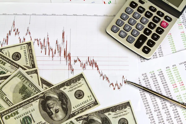 Pen ,calculator and dollars on financial Graphs — Stock Photo, Image