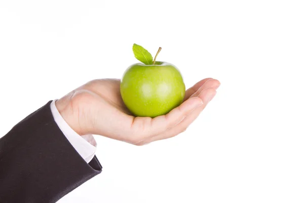 Επιχειρηματίας χέρι με ένα πράσινο μήλο στο χέρι του απομονωθεί σε λευκό — Φωτογραφία Αρχείου