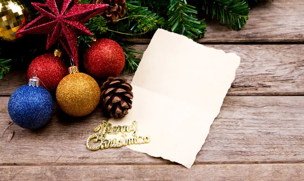 Christmas decoration with blank vintage old paper over old wood — Stock Photo, Image