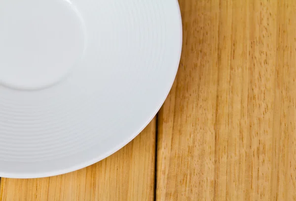 Closeup of plate on old white wood table — Stock Photo, Image