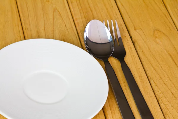 Closeup of plate on old white wood table — Stock Photo, Image