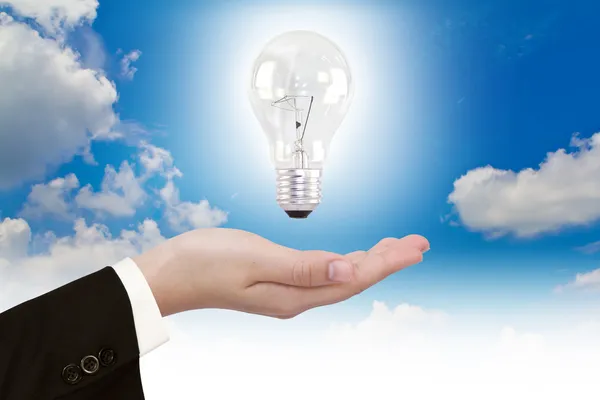Women hand with Light bulb — Stock Photo, Image