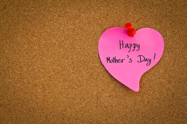 Post it notes with word " Happy Mother's Day "on a cork board — Stock Photo, Image