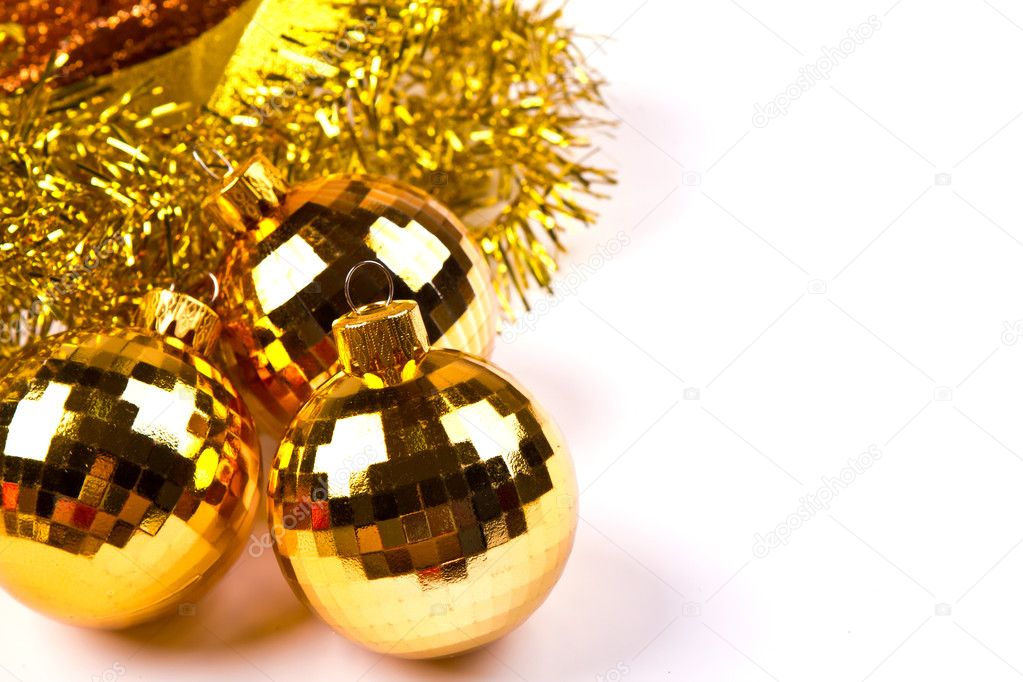 Shiny gold christmas balls on white background with copy space.