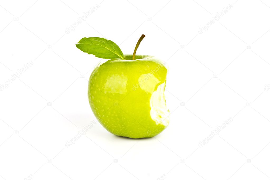 Fresh green apple with a bite isolated on white background