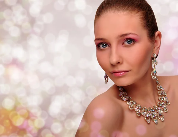 Beautiful woman with jewelry — Stock Photo, Image