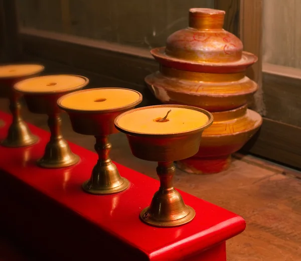 Lucky butter burning lamps and tibet jugs — Stock Photo, Image