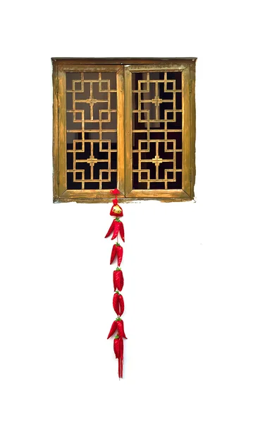 Isolering foto av röd paprika dekoration hänga på en trä windo — Stockfoto
