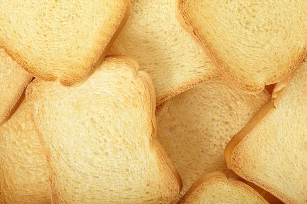 Toast eller rusk bröd bakgrund — Stockfoto