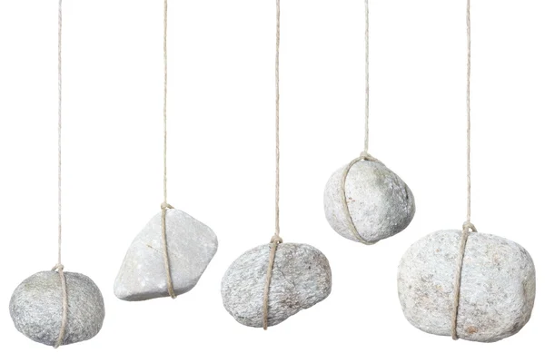 Stone, rock hanging by a string — Stock Photo, Image