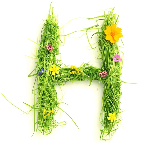 Letters made of flowers and grass — Stock Photo, Image