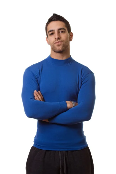Athletic man in blue compression shirt. Studio shot over white. — Stock Photo, Image