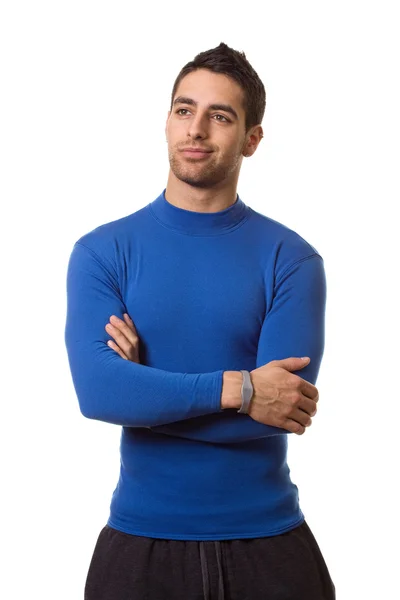 Athletic man in blue compression shirt. Studio shot over white. — Stock Photo, Image