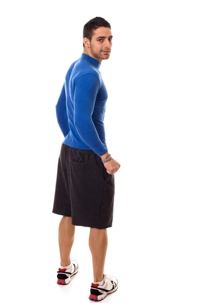 Lekkoatletycznego młody człowiek w koszuli niebieski kompresji. łapka na biały. — Zdjęcie stockowe