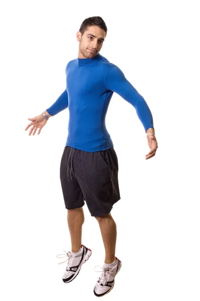 Athletic young man in a blue compression shirt. Studio shot over white. — Stock Photo, Image