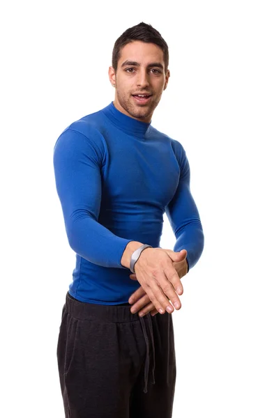 Sportovní mladý muž v modrém komprese košili. Studio zastřelil bílá. — Stock fotografie