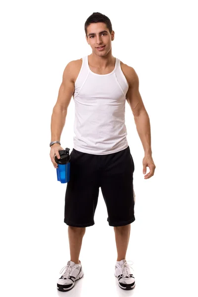 Athletic man with water bottle. Studio shot over white. — Stock Photo, Image