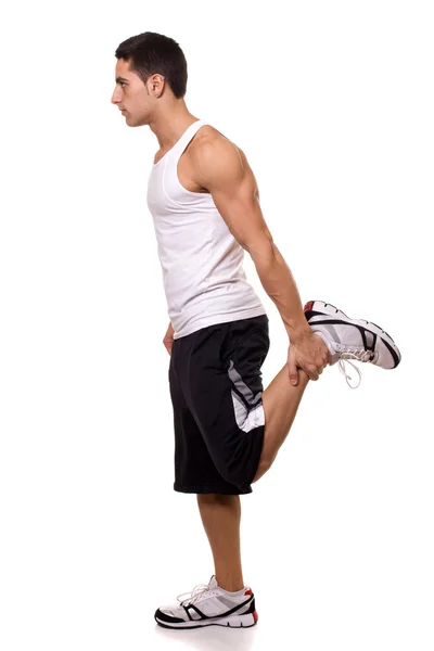 Esticar quadríceps de pé. Estúdio tiro sobre branco . — Fotografia de Stock