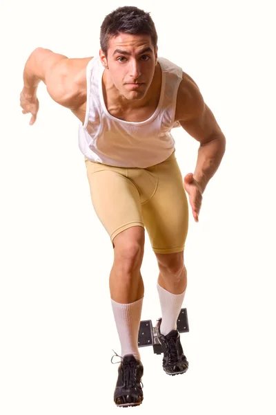 Track and field athlete at start of sprint. Studio shot over white. — Stock Photo, Image