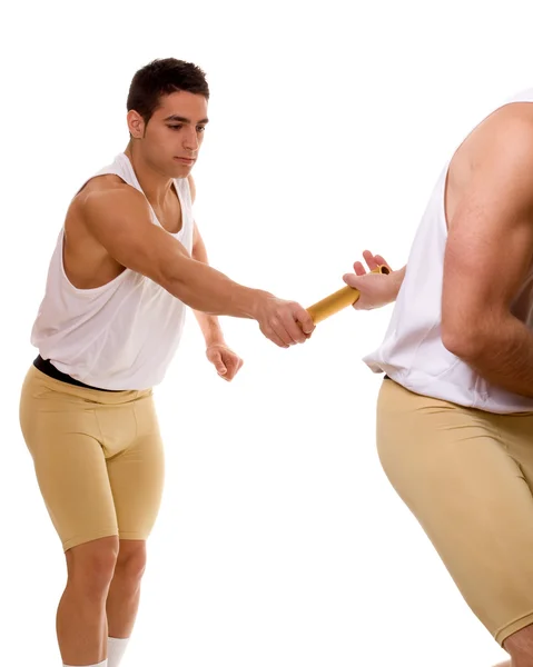 Track and field athletes passing relay baton. Studio shot over white. — Stock Photo, Image